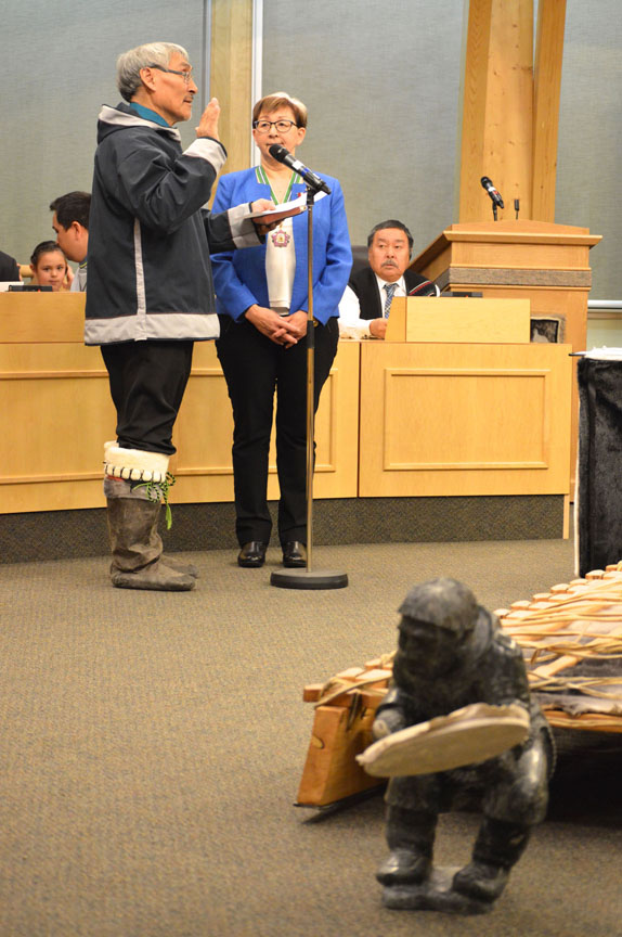 Netsilik MLA Emiliano Qirngnuq, clad in an atigi and summer-style sealskin kamiks, takes his oath of office Nov. 21. (STEVE DUCHARME)