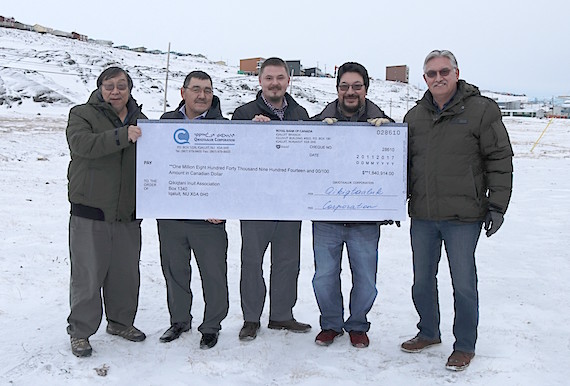 Board members of the Qikiqtani Inuit Association and the Qikiqtaaluk Corp. stand with a giant-sized cheque of the $1.8 million dividend the QC has given the QIA for its Legacy Fund. (HANDOUT PHOTO)