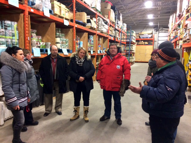 Quebec's minister for aboriginal affairs, Geoff Kelley, and minister responsible for housing, Lise Thériault, visit the Kativik Municipal Housing Bureau's main warehouse in Kuujjuaq Jan. 25 as part of a two-day trip to Nunavik. The minister met with regional leaders to discuss their government's investment in social housing and how to better support low-income households across Nunavik, the Quebec government said in a release. (PHOTO COURTESY GOVERNMENT OF QUEBEC) 