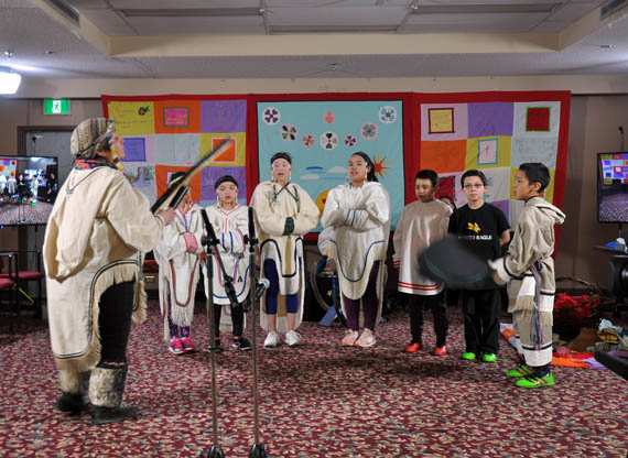 Grade 5 and 6 students from Rankin Inlet's Simon Alaittuq school perform a drum dance and song written by the late Mariano Aupilardjuk. The group performed at the closing ceremonies of the National Inquiry into Missing and Murdered Indigenous Women and Girls' three-day hearing in the Kivalliq community last week. (PHOTO BY SARAH ROGERS) 