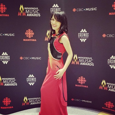 Nunavut singer Kelly Fraser models Kyak's sealskin sakiaguti as an embellisment over her dress at the recent Indigenous Music Awards in Winnipeg. The dress was made by Melissa Attagutsiak. (PHOTO COURTESY OF K. FRASER) 