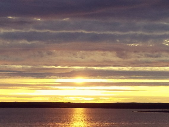 Caroline Robinson snagged this image of the midnight sun behind a lake near Cambridge Bay one evening earlier this month, at 10:50 p.m. (PHOTO COURTESY OF CAROLINE ROBINSON)