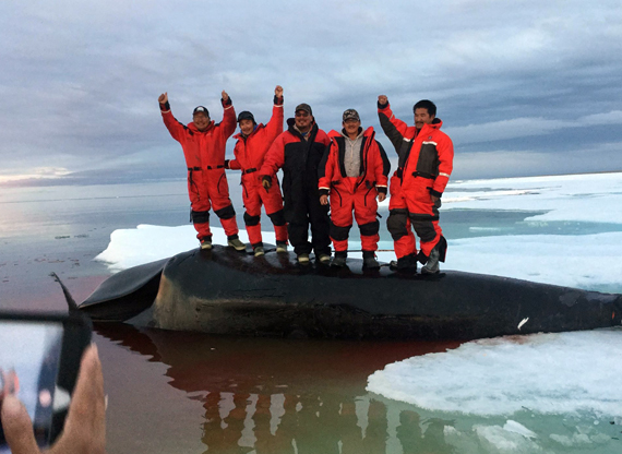 Coral Harbour's bowhead whale–hunting crew stands on its catch on June 28 just outside the Kivalliq community. (PHOTO BY GREG NINGEOCHEAK) 