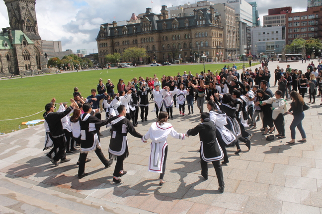 Nunavut Sivuniksavut students kick up their heels in a square dance in front of Parliament Hill in Ottawa to celebrate life and raise awareness about suicide prevention last year on World Suicide Prevention Day. The annual event, hosted by the National Inuit Youth Council and Inuit Tapiriit Kanatami, included performances and speeches to coincide with World Suicide Prevention Day and Nunavut's Embrace Life Day, observed on Sept. 10. (FILE PHOTO)