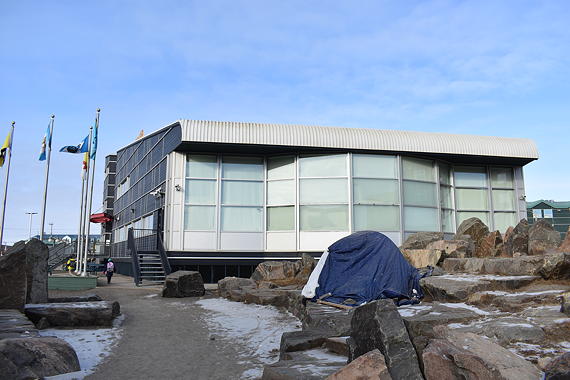 Brian Tagalik has been sleeping in this tent outside the legislative assembly in Iqaluit since last month in an effort to get his family further ahead on the waiting list for public housing. (PHOTO BY COURTNEY EDGAR)