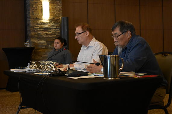 Qikiqtani Inuit Association's finance director, Scott Wells, centre, presents a financial report at the organization's annual general meeting on Tuesday at the Frobisher Inn. (PHOTO BY COURTNEY EDGAR)

