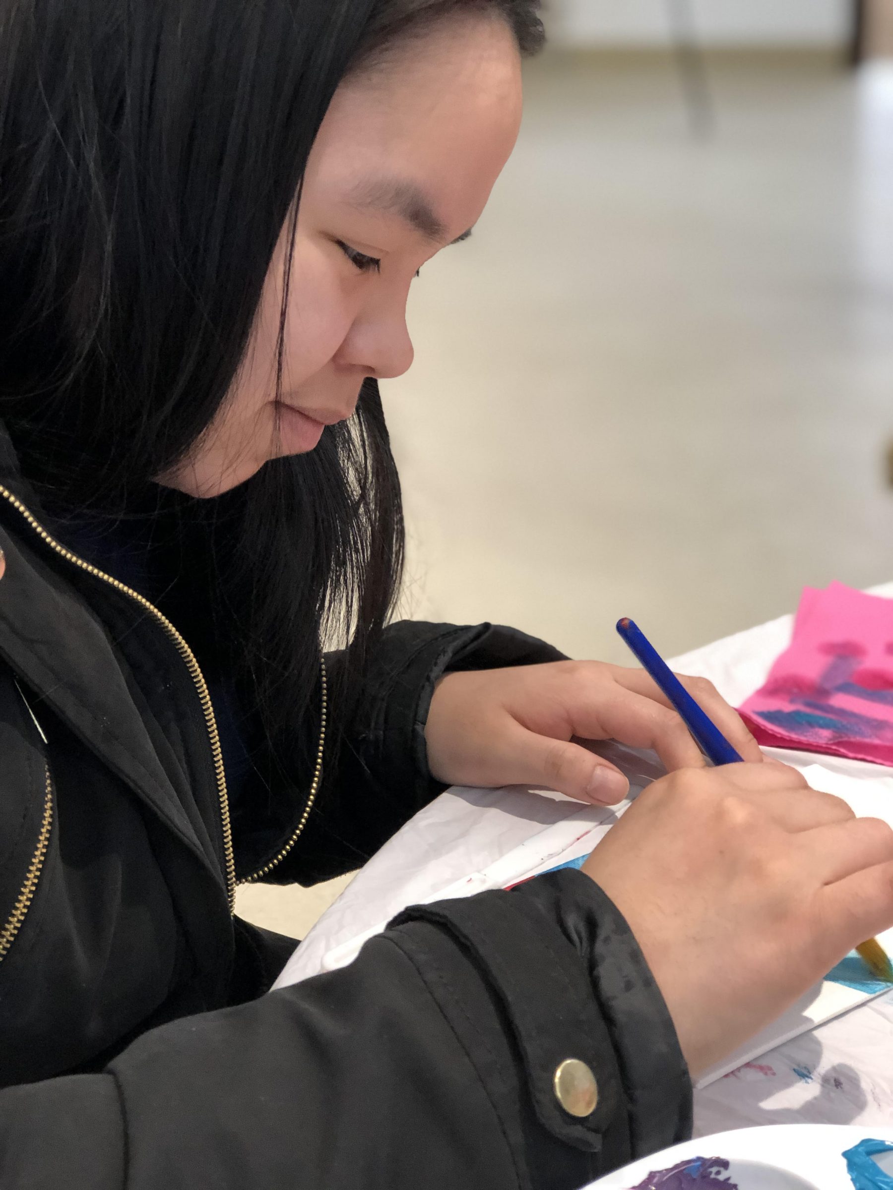 Ashley Kalluk paints during Nunavut Sivuniksavut’s weekly cultural workshop on Wednesday, Jan. 31. Students are selling paintings and canvases to fundraise for their cultural exchange year-end trip to Hawaii and Peru. (Photo by Dayna Bruce)