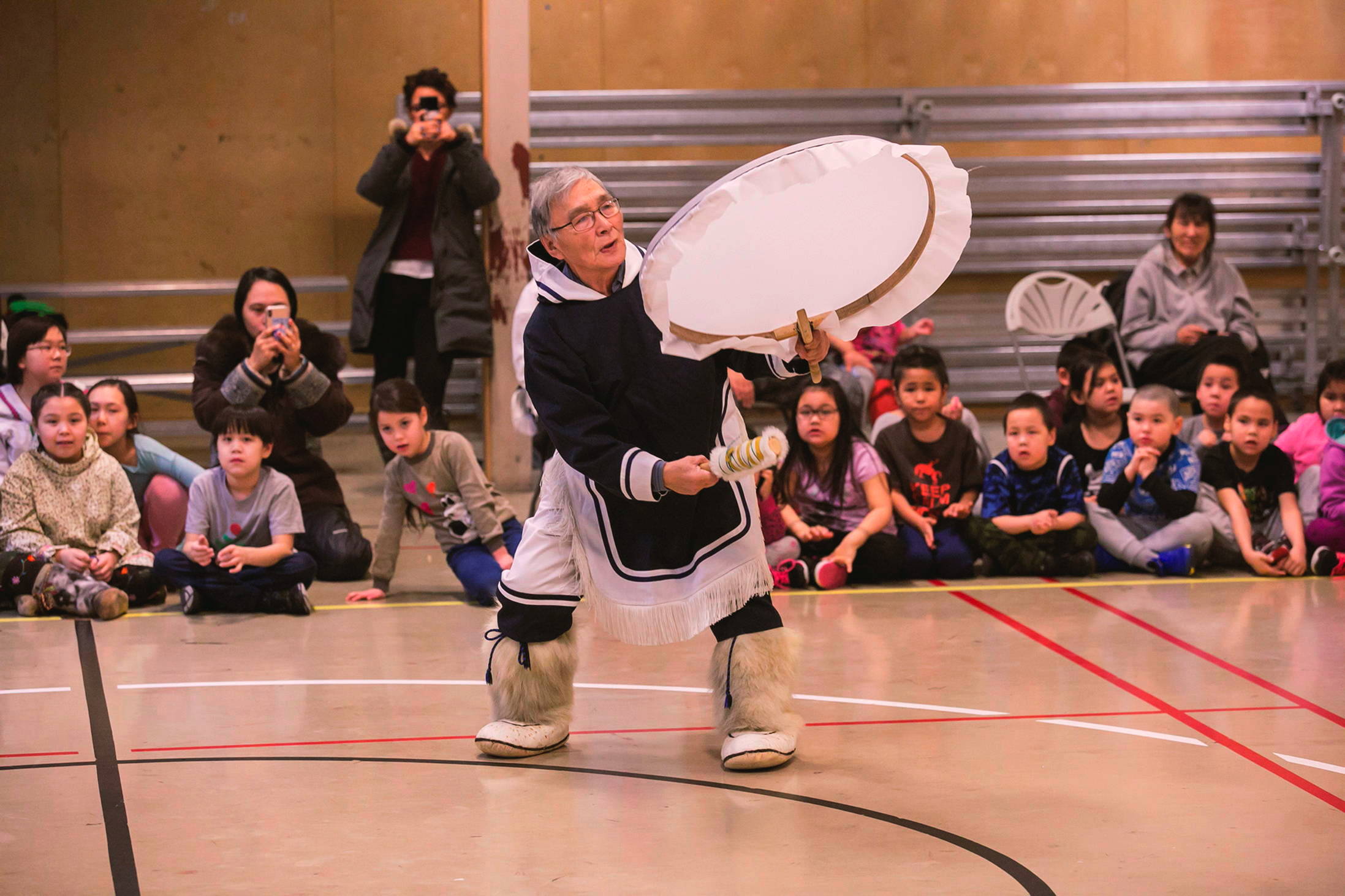 Drum dancer David Nanook celebrates the return of the sun at Netsilik School in Taloyoak on Thursday, Jan. 31. (Photo by Jonathan Nuss)