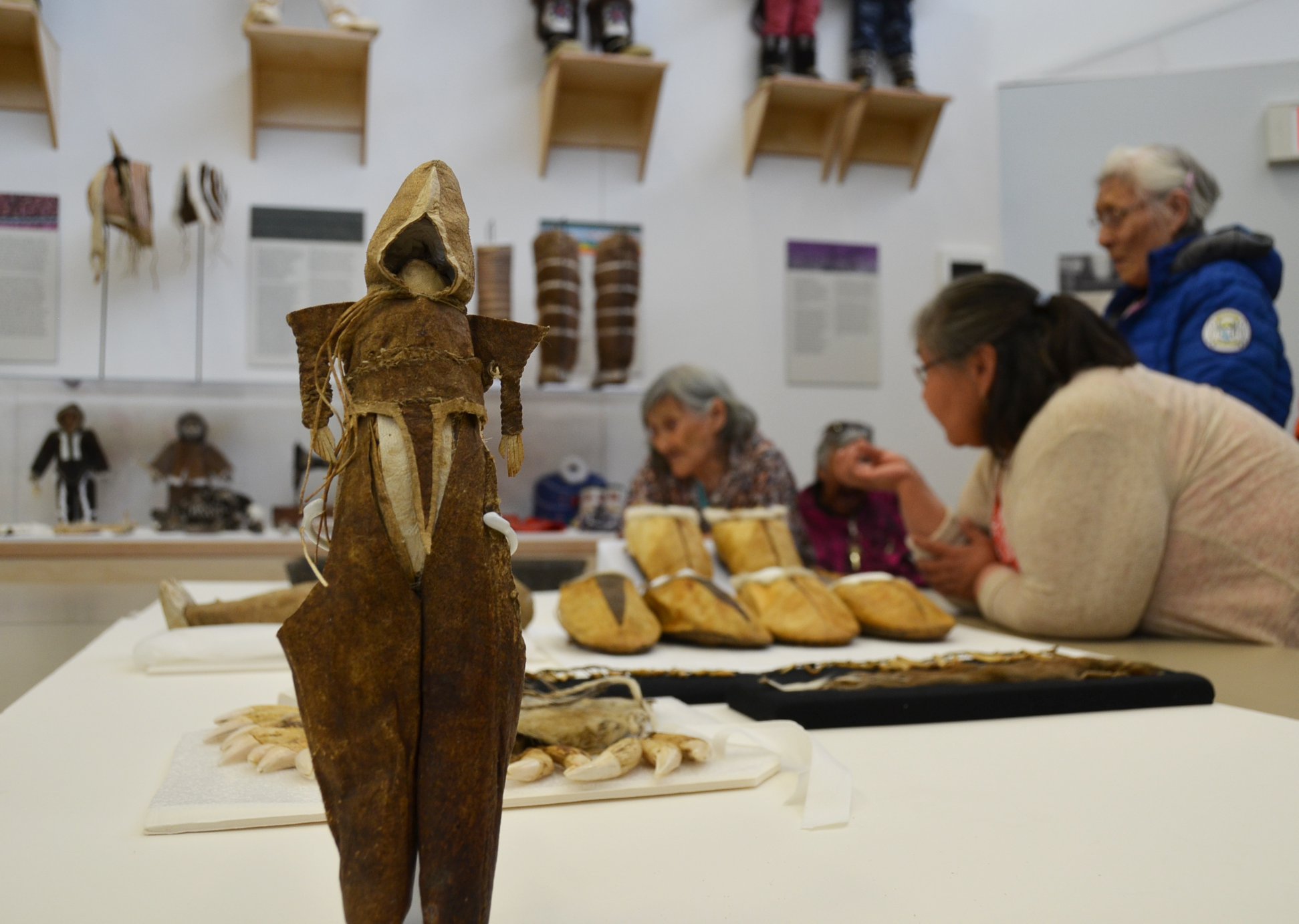 This doll was collected from Inuinnait living along the Coronation Gulf around 1915 by the Canadian Arctic Expedition’s anthropologist, Diamond Jenness. After being displayed in Cambridge Bay by the Pitquhirnikkut Ilihautiniq (Kitikmeot Heritage Society) it’s now being returned to the Canadian Museum of History to make room for new incoming loan objects. The new exhibit will serve as research tools for a new series of community cultural revitalization workshops on crimped shoe making, the creation and use of amulets, and Inuinnaqtun terminology surrounding ancestral Inuinnait traditions and technologies. A workshop of local elders and language experts also took place this summer to help interpret objects. (Photo courtesy of Pitquhirnikkut Ilihautiniq / Kitikmeot Heritage Society)