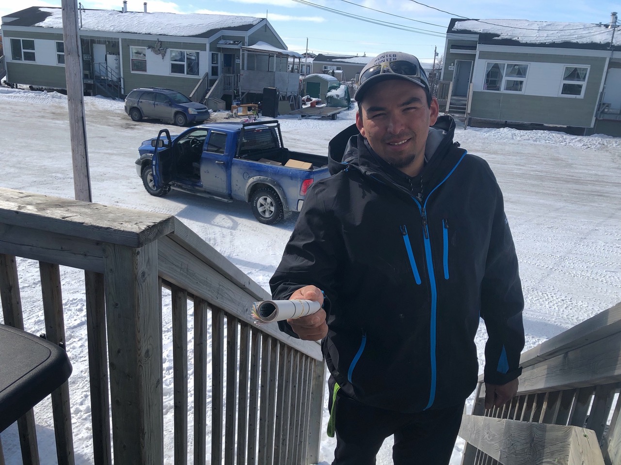 George Kauki with Kuujjuaq’s Pinguatitsijingiit Recreation Committee delivers bingo cards to a household for a free community bingo game broadcast over the radio on Easter Monday. Prizes included a 75-inch TV, a helicopter ride, a generator, a flat-bed trailer, 45 gallons of gas and more. Kauki also arrived bearing gifts, like sleds, for children. (Photo courtesy of Isabelle Dubois)