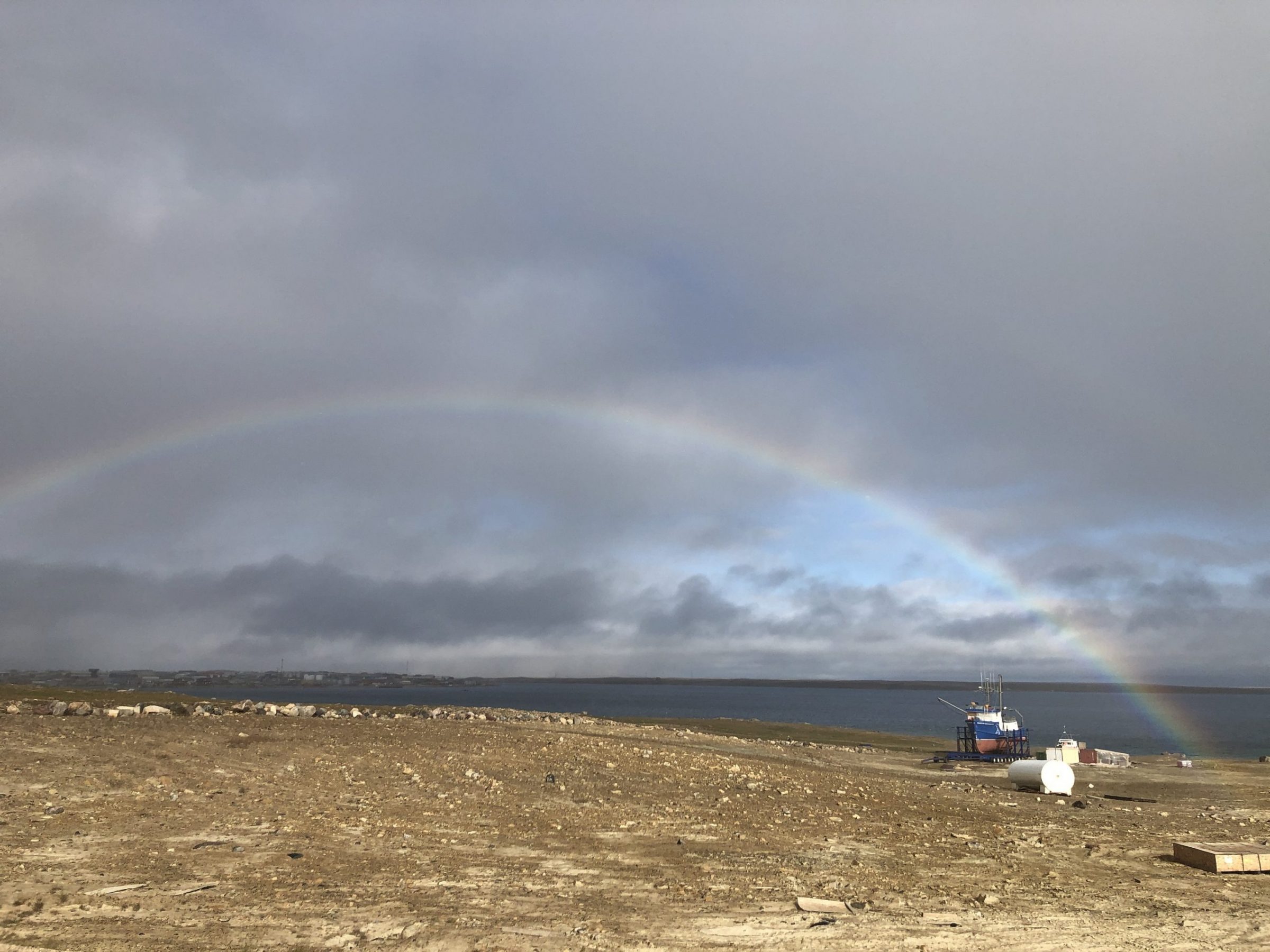 Jamie Taipana of Cambridge Bay caught this photo of a rainbow arching over the Martin Bergmann, a vessel operated by the Arctic Research Foundation, on Tuesday, Aug. 11. (Photo courtesy of Jamie Taipana)