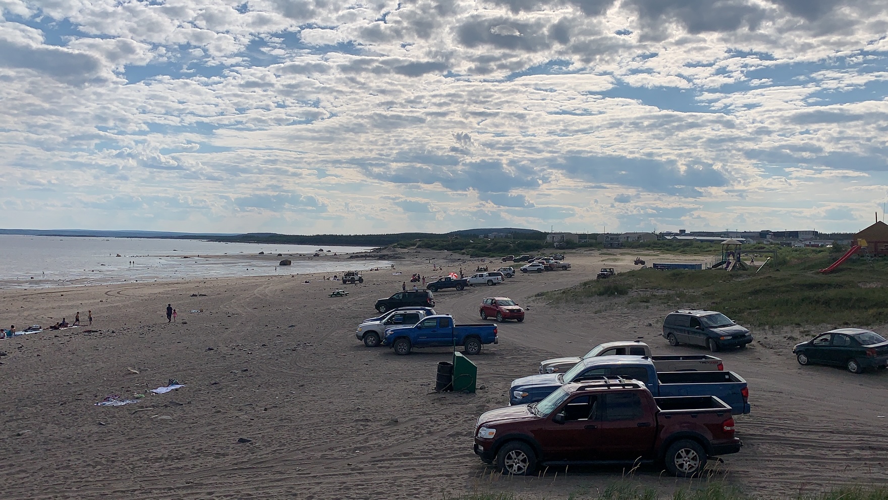 Kuujjuaq is experiencing a particularly hot summer. With temperatures reaching 30C with humidity, Kuujjuammiut flocked to the beach on Monday, Aug. 17, to swim and cool down. (Photo by Malaya Qaunirq Chapman)