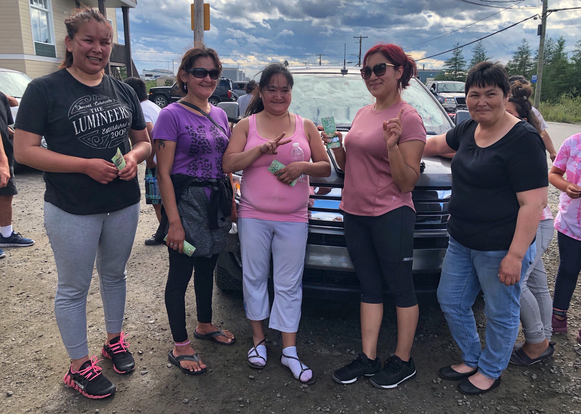 On Tuesday, Aug. 11, Kuujjuaq’s runners took part in a race organized by the Kuujjuaq Pinguatitsijingiit recreation committee. Here are the winners in the category for women aged 16 to 39, with recreation committee member Eva Kauki. From right to left: Amelia Whiteley Tukkiapik, first place, winner of a $500 prize; Jessie Munick, second place, winner of $400; Jeannie Makiuk, third place, winner of $300; and Emma Cain, fourth place, winner of $200. Participants in this category had to run all the way to the marina and back, a total of 12 km. (Photo by Isabelle Dubois)