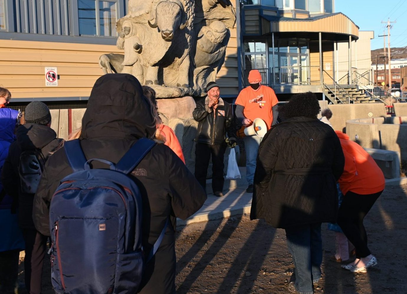 Jack Anawak speaks to a crowd of 30 gathered in Iqaluit for Orange Shirt Day on Wednesday, Sept. 30. Anawak, who attended residential school in Chesterfield Inlet, said the experience was horrible because of physical, sexual and emotional abuse. But he said students did receive educations that allowed them to go on to help write the Nunavut Agreement and play a role in creating their territory. Orange Shirt Day is held to honour the experiences of Indigenous children in residential schools. The gathering was organized by the Nunavut Employees’ Union and the Public Service Alliance of Canada. (Photo by Meagan Deuling)