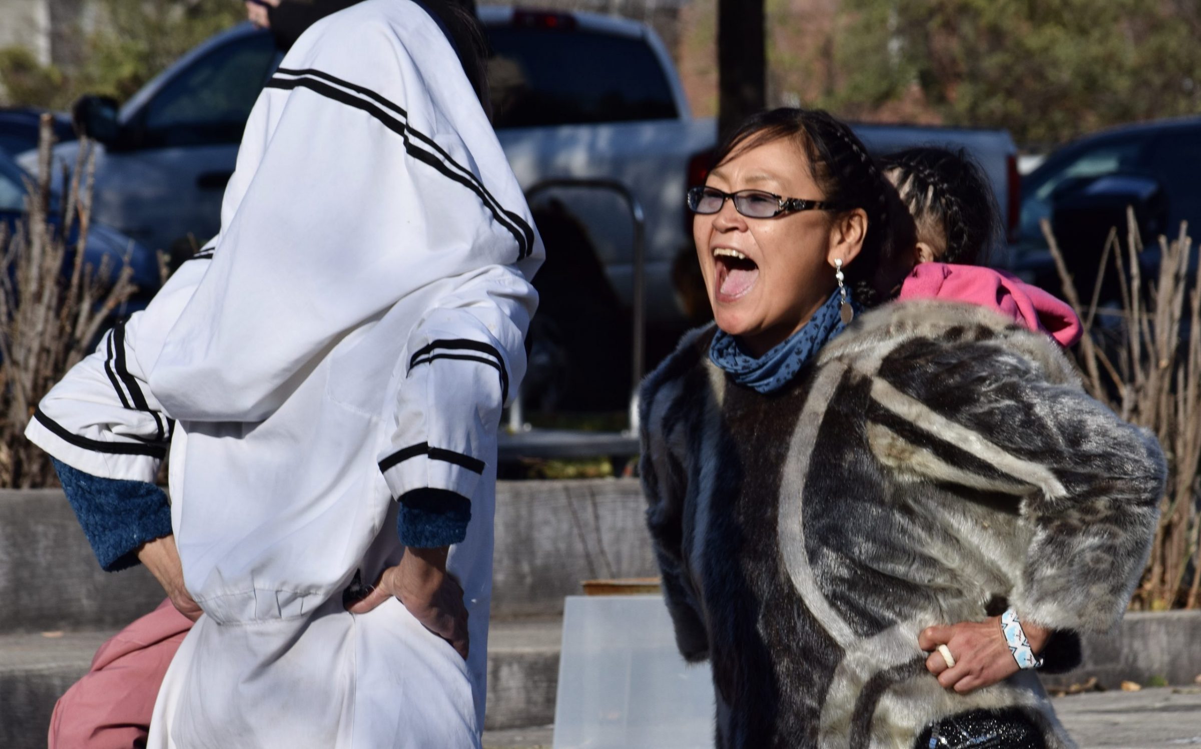 Members of the Tununiq-miut Theatre perform a traditional Inuit song and dance at the official opening of Annie Pootoogook Park in Ottawa on Nov. 7. The ceremony honouring the late artist coincided with International Inuit Day. From left: Sarahme Akoomalik, Sheena Akoomalik and Rosalyn Katsak (on back). (Photo by Madalyn Howitt)