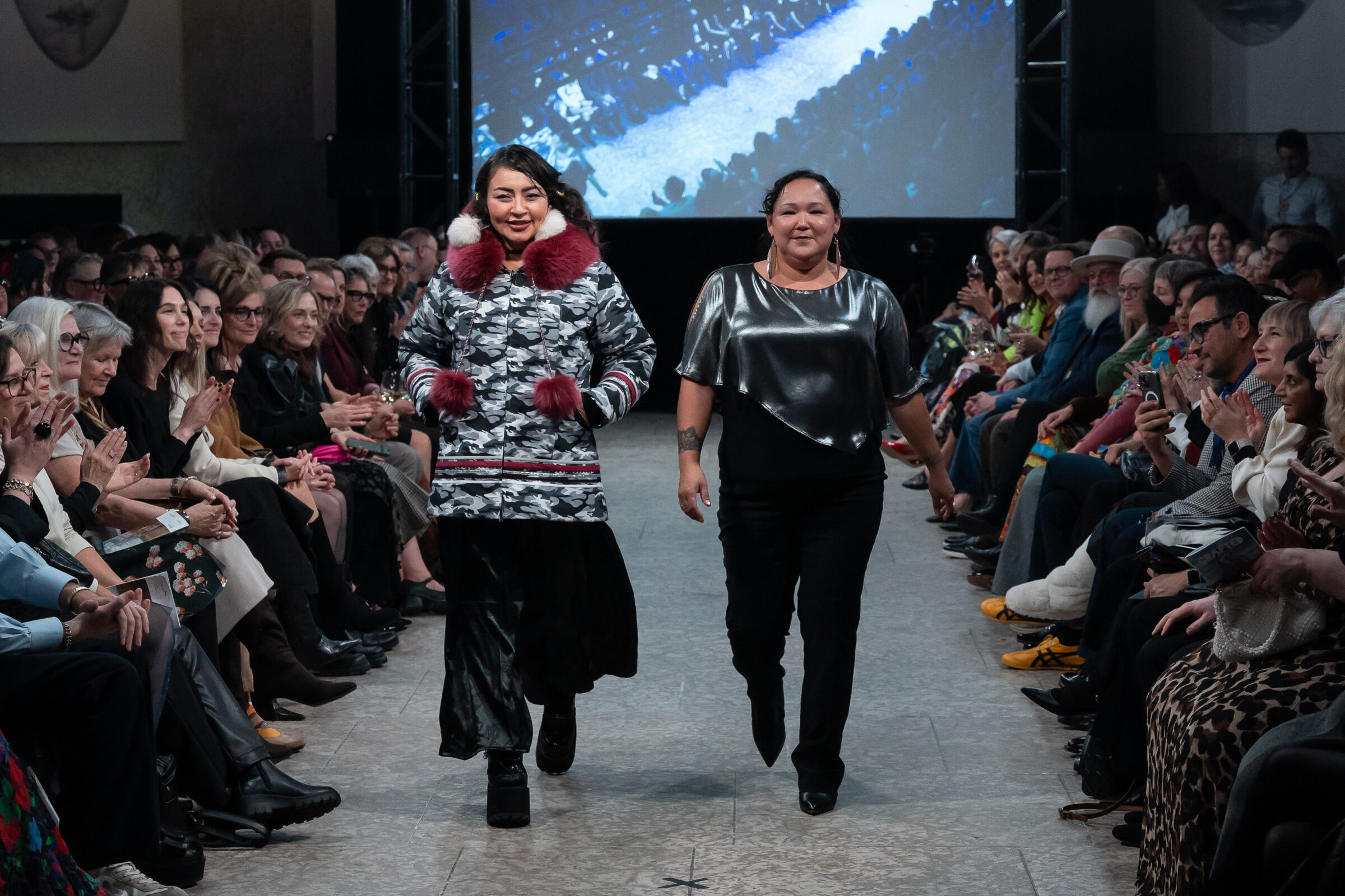 Ottawa actor Zorga Qaunaq, left, who plays Millie on the CBC show “North of North,” models winterwear designed by artist Ittuvik Paquet of Salluit. The pair strutted in the Crafted on the Catwalk event Tuesday at the Winnipeg Art Gallery-Qaumajuq. It was Paquet’s third time featuring work at the annual show. (Photo courtesy of Sherri Van Went/Winnipeg Art Gallery-Qaumajuq)